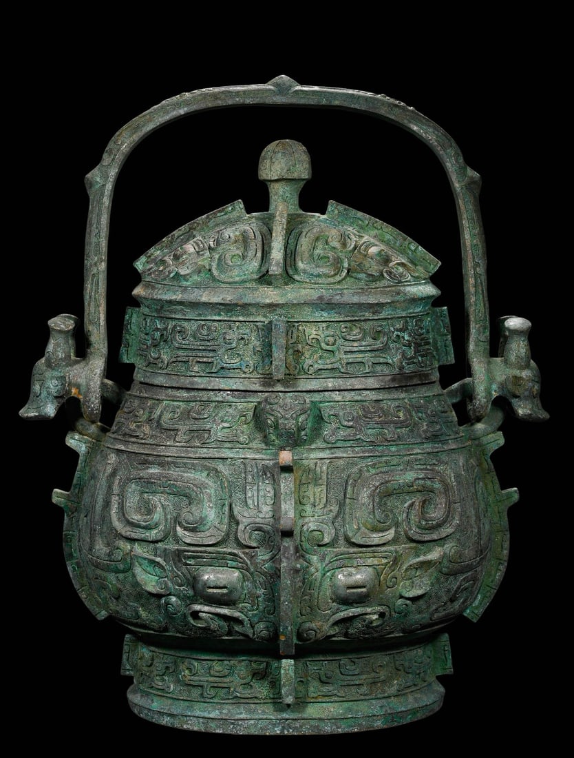 Bronze Animal?Mask Patterned You with Overhead Handle: Bronze Animal?Mask Patterned You with Overhead HandleSuggested Period: Late Shang – Early Western ZhouDimensions: Height 48?cm (18.90?in), Width 35?cm (13.78?in)Inscription: Cast inscription on inne