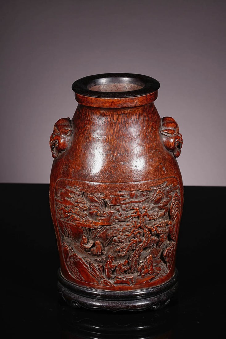 Bamboo?Carved Vase with Landscape, Figures and Animal?Head Handles: Bamboo?Carved Vase with Landscape, Figures and Animal?Head HandlesSuggested Date: Qing DynastyBasic SpecificationsDimensions: Height 29?cm (11.42?in), Width 17?cm (6.69?in); Weight 1640?gMaterial: