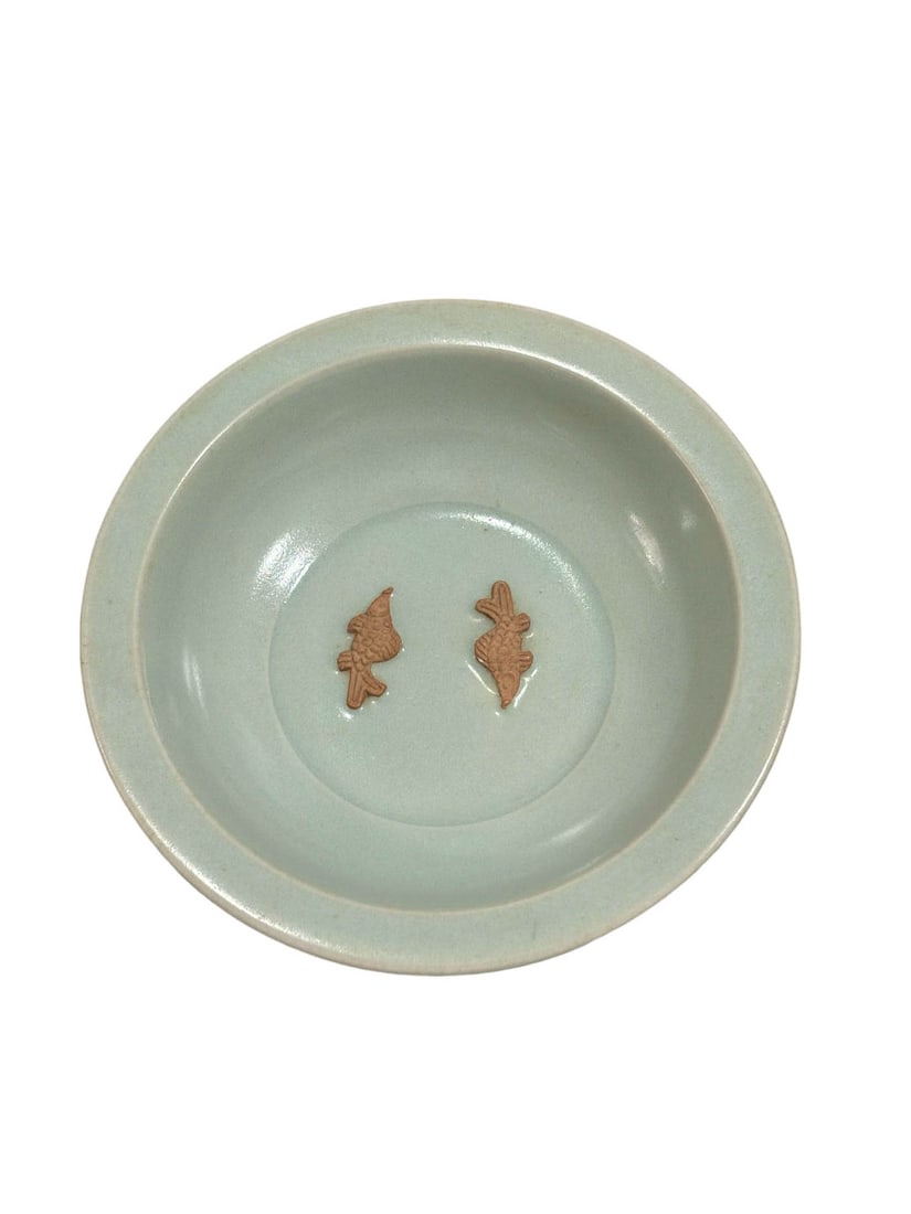 Longquan Celadon Washer with Applied Twin?Fish Decoration: Longquan Celadon Washer with Applied Twin?Fish DecorationProposed Date: Yuan Dynasty, Longquan KilnDimensions: Diameter 14?cm (5.51 in), Height 3.7?cm (1.46 in)Object DescriptionMaterial and