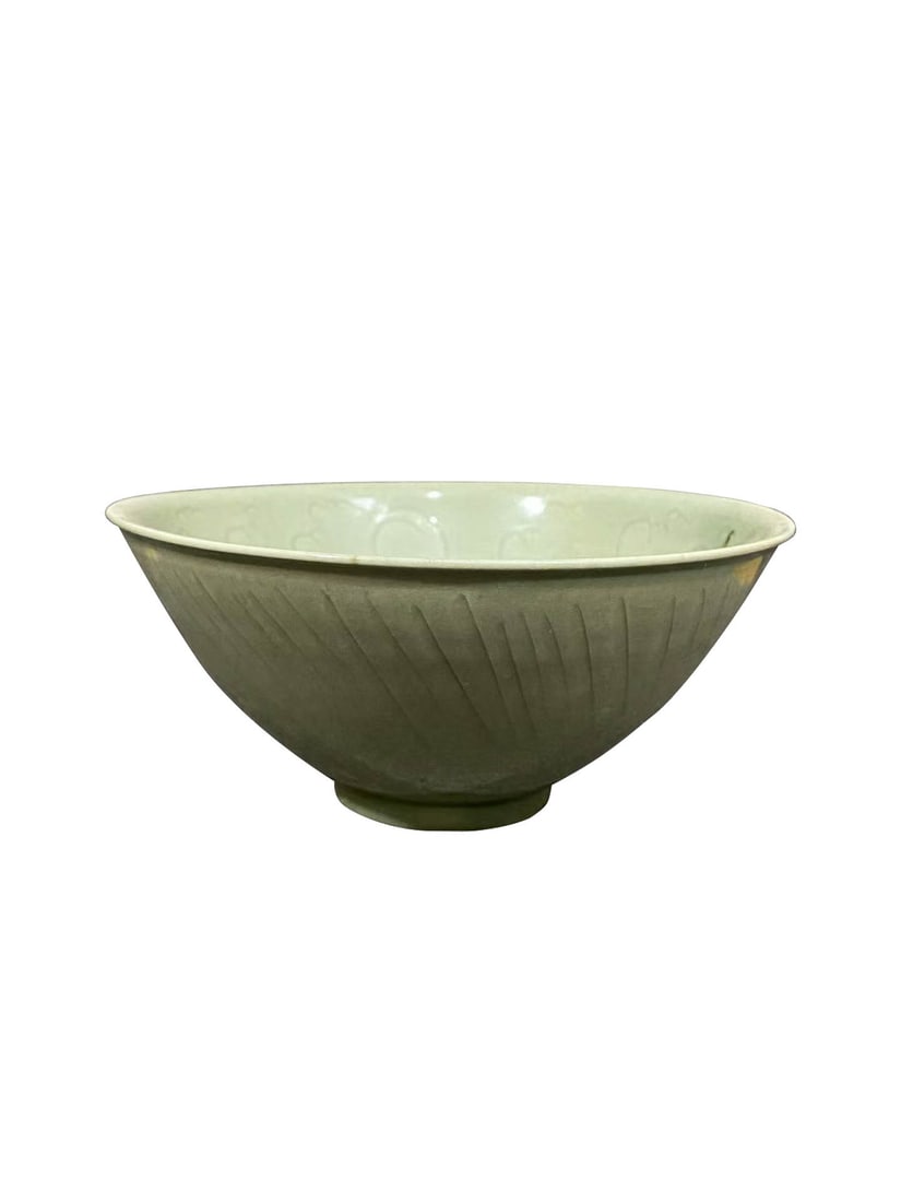 Longquan Celadon Carved Foliage Conical Bowl: Longquan Celadon Carved Foliage Conical BowlSuggested Period: Yuan?Ming Dynasty, Longquan Kiln GroupDimensions: Diameter 7.09 in, Height 3.15 inObject DescriptionMaterial & CraftsmanshipThis large