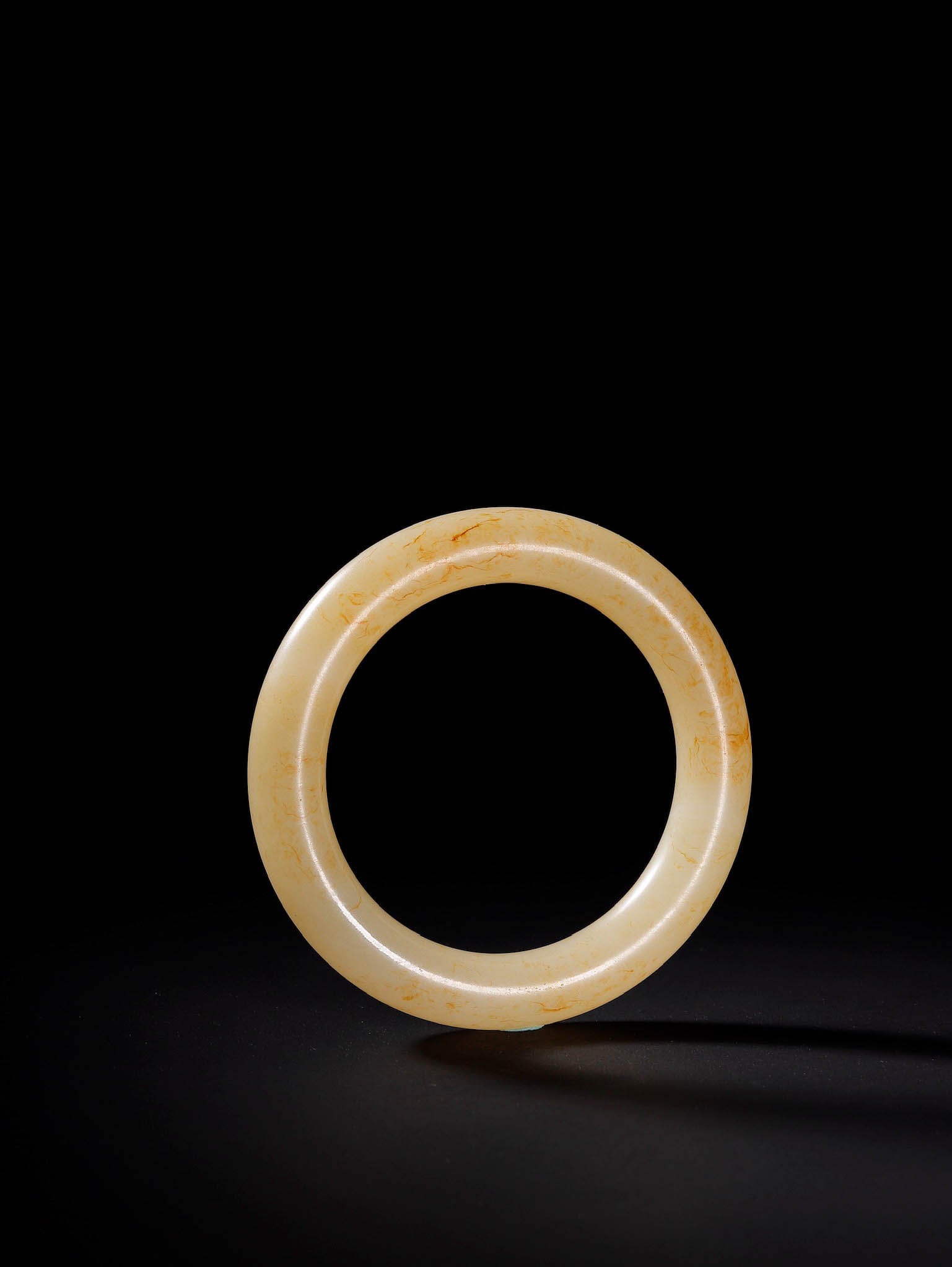 Hetian Jade Bangle with Hair?Like Vein Inclusions: Hetian Jade Bangle with Hair?Like Vein InclusionsProposed Period: Qing DynastyDimensions: Inner Diameter 2.17 in, Band Thickness 0.43 inWeight: 56.3 gCondition: Complete and intact. No breaks, cracks