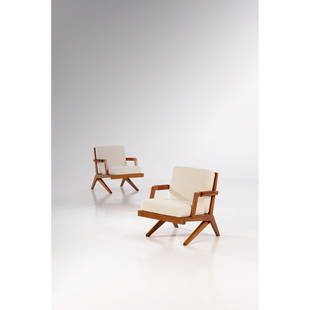 Olavi Hanninen (1920-1992) Boomerang: Olavi Hanninen (1920-1992) Boomerang Pair of armchairs Wood, leather and fabric HMN Huonekaluliike Mikko Nupponen Edition Creation date: circa 1950 H 77XL 70,5XP 75 cm