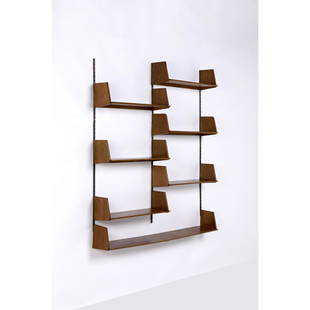 Marcel Gascoin (1907-1986) Set of seven wall shelves: Marcel Gascoin (1907-1986) Set of seven wall shelves Oak wood and metal ARHEC edition Creation date: circa 1950 Large: H 22,5 ×L 154 ×P 26cm Small: H 22,5 ×L 77 ×P 26cm Bibliograph