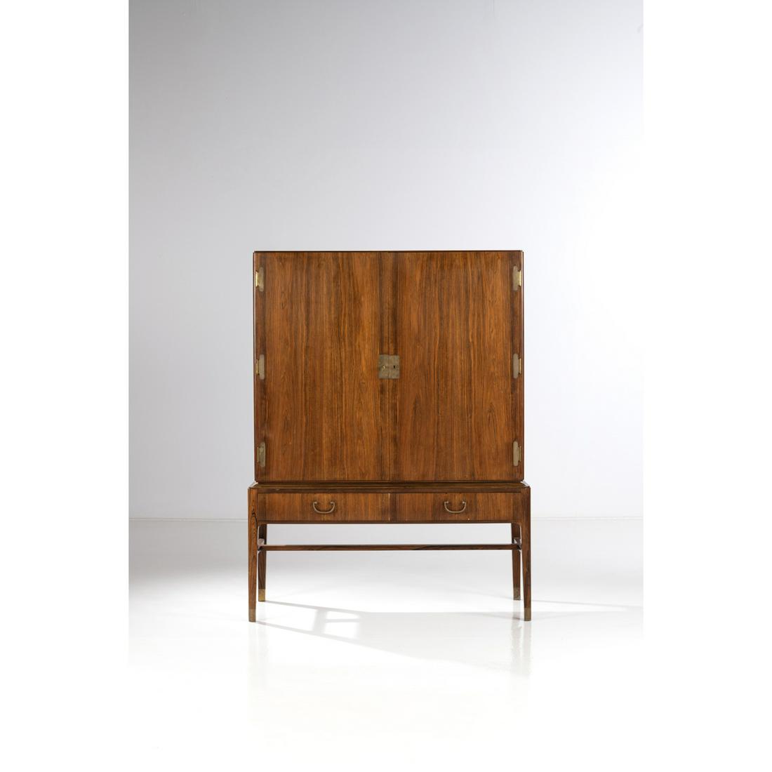 Ernst Kühn (1890-1948) Cabinet: Ernst Kühn (1890-1948)CabinetRosewood and brassCreation date : circa 1930H 165 x L 125,5 x P 51 cm