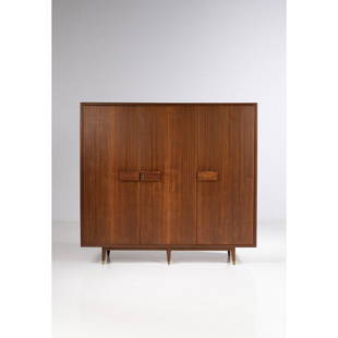 Gio Ponti (1891-1979) Armoire: Gio Ponti (1891-1979)ArmoireWalnut, brass and mirrorEdited by Mobili Moderni Dassi, Lissone(label)Creation date: circa 1954H 175×L 190×P 61 cmProvenance: Similar model designed for the Royal