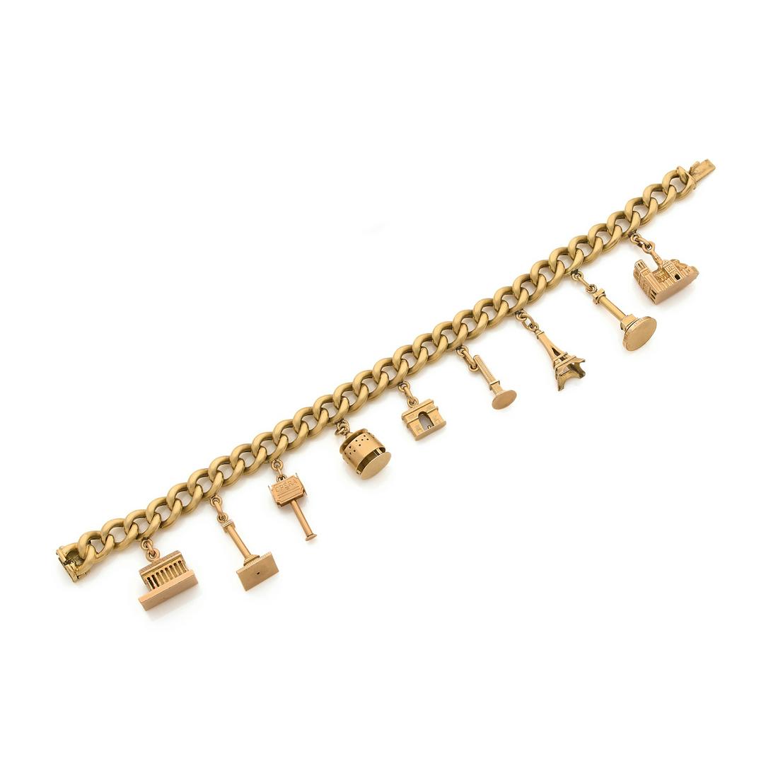 Charms bracelet in 18k yellow gold adorned with nine (1 of 1)