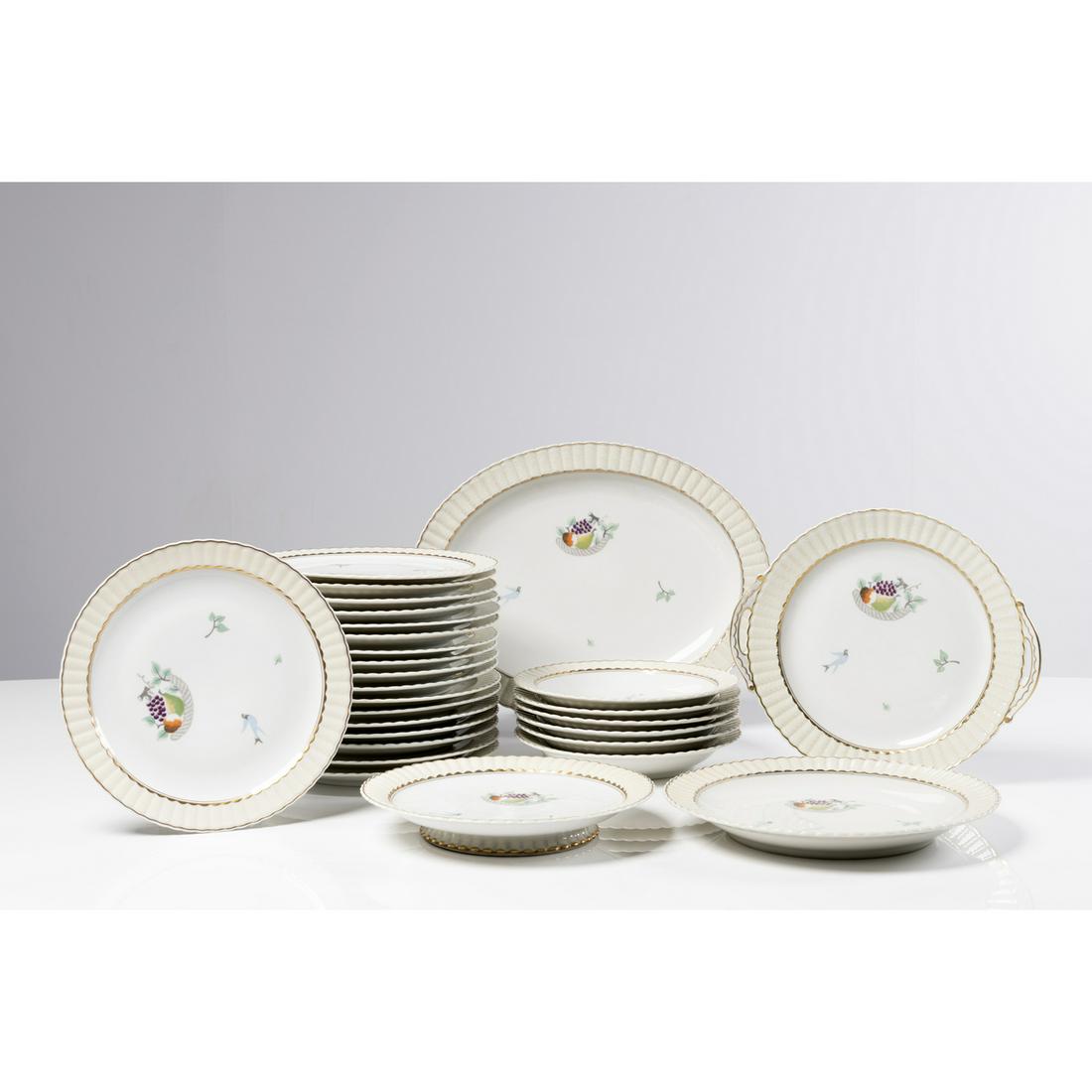 Primavera et Bernardaud (Limoges) Table service, circa: Primavera et Bernardaud (Limoges)Table service, circa 1940Porcelain with fruits and birds18 plates6 deep plates1 oval dish1 fruit bowl1 round dish1 service dish with handlesSome pieces labeled 'Bernar