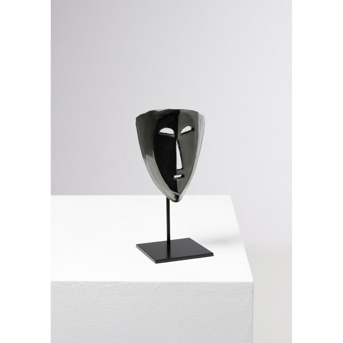 Accolay (20th c.) Mask: Accolay (20th c.)MaskGlazed ceramic and lacquered metalSigned 'Accolay AP' on the inside of the maskModel created circa 1960Mask: H 15,5 × L 11 × P 9 cmPlinth: H 22 × L 10 × P 10 c