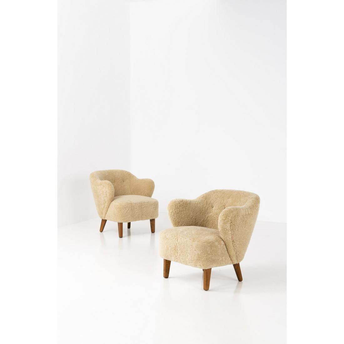 Flemming Lassen (1902-1984) Easy chairs: Flemming Lassen (1902-1984)Easy chairsPair of armchairsSheepskin and teakEdited by Jacob KjaerModel created circa 1940H 77 x L 76 x P 71 cmBibliography:- H. C. Hansen, 'Snedkerlaugets 14. Mobeludstill