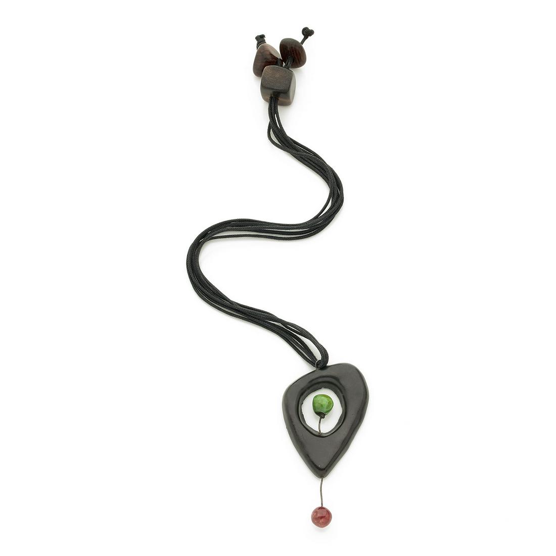 ACCOLAY 1970s: ACCOLAY1970sNecklace in ceramics, metal, triple cotton cordon and three elements in carved wood, including one designed to adjust the length of the necklace.Total length : 46 cmDimensions of the pende