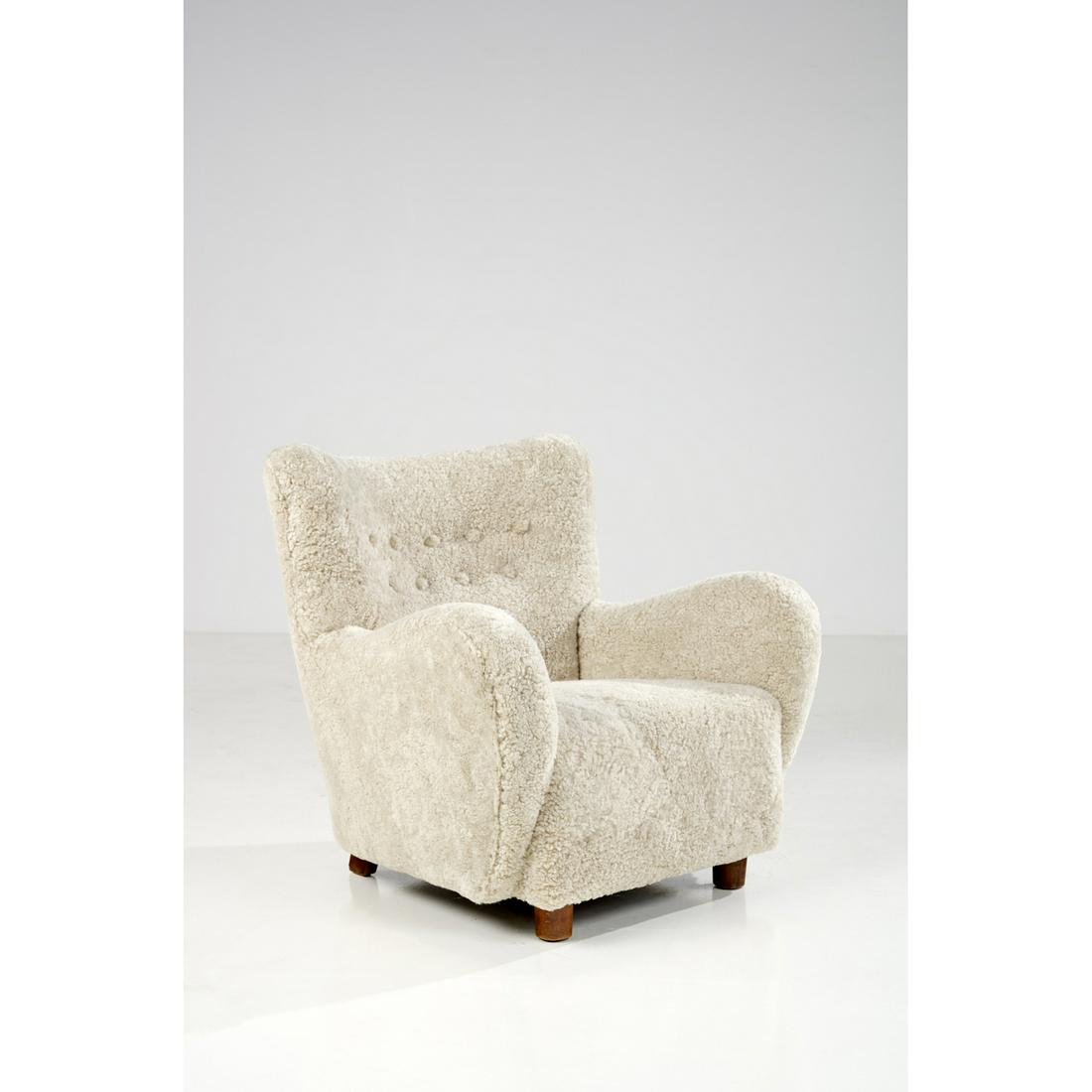 Flemming Lassen (1902-1984) Armchair: Flemming Lassen (1902-1984)ArmchairSheepskin and teakEdited by Jacob KjaerModel created circa 1940H: 76 x 80 W: 68 cm