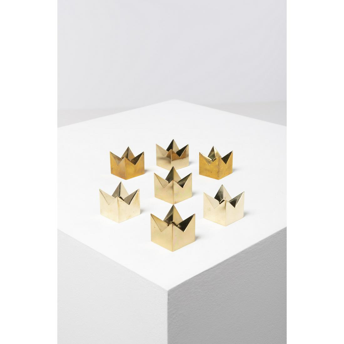 Gunnar Ander (1908-1976) Set of sept candleholders: Gunnar Ander (1908-1976) Set of sept candleholdersGolden brassModel KronanModel created circa 1950Edited by Skultuna 1607Signed and annotated Sweden beneath the baseH : 4 cm L : 4 x 4 cm
