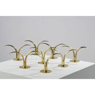 Ivar Alenius Bjork (1905-1978) Set of eight candleholders: Ivar Alenius Bjork (1905-1978)Set of eight candleholders Golden brassEdited by Ystad-MetallMonogrammed beneath the base IAB and annotated SwedenH: 11,5 x L: 21,5 cm