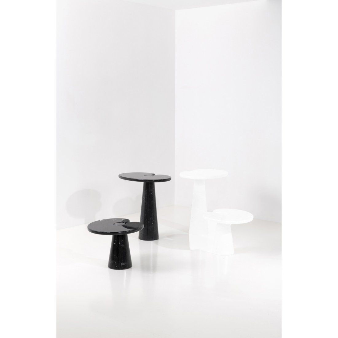 Angelo Mangiarotti (1921-2012) Eros: Angelo Mangiarotti (1921-2012) Eros Set of two side tables Marquina marble Edited by Skipper Manufacturer's label beneath the tabletop Model created circa 1970 H 72 Ã— L 66 Ã— W 46 cm H 39 Ã—