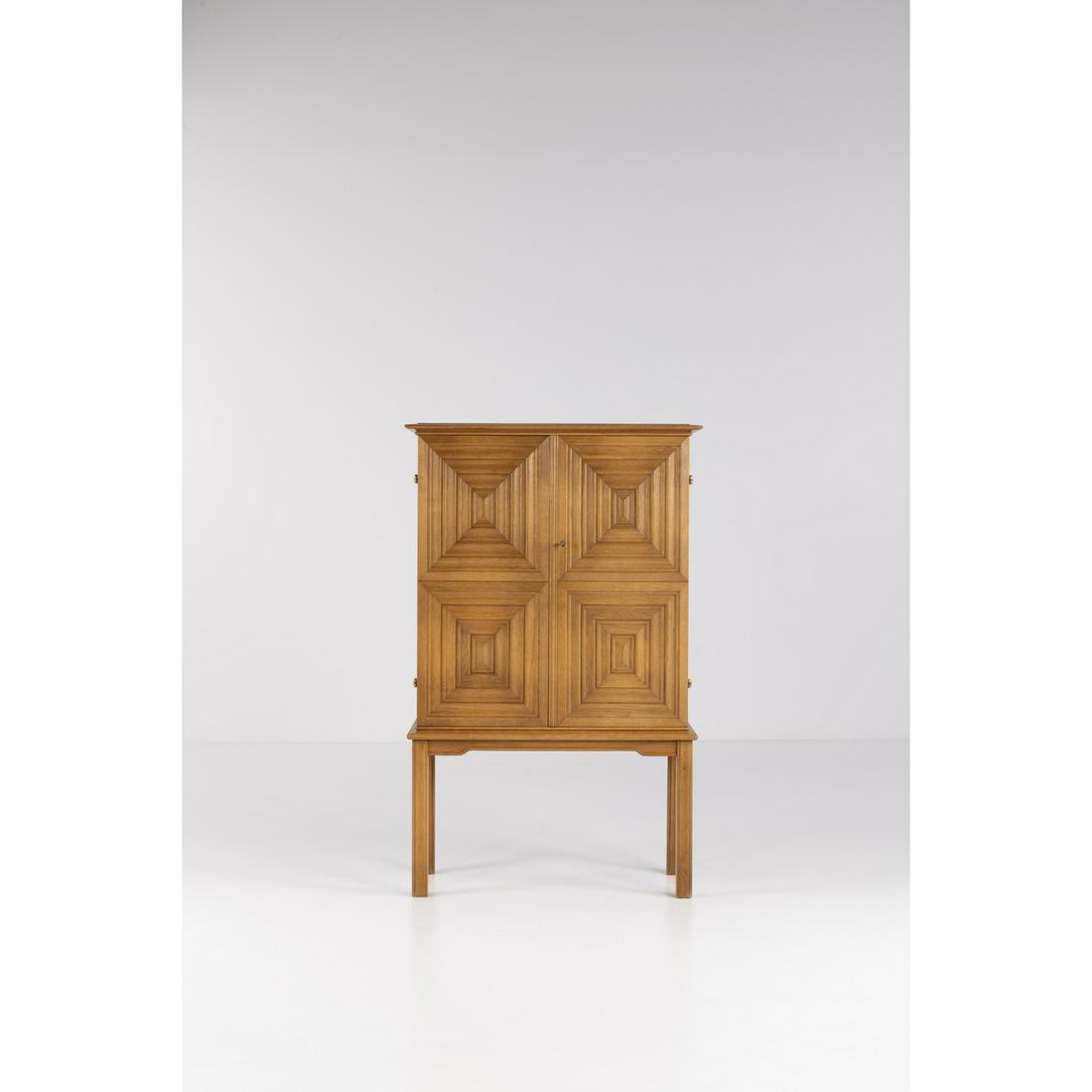 Oscar Nilsson (1895-1975) Cabinet: Oscar Nilsson (1895-1975)CabinetOak wood and brassEdited by Jacob WickmanManufacturer's stampModel created circa 1940H 133,5 × L 83 × P 41 cm