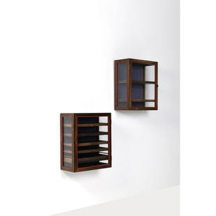 Poul Østergaard (20th c.) Pair of wall cabinets: Poul Østergaard (20th c.)Pair of wall cabinetsRosewood, glass, brass and fabricEdited by Alfred KlitgaardEngraved plaque, 'Design POUL ØSTERGAARD Traearbejde ALFRED KLITGAARD 1981' inside ea