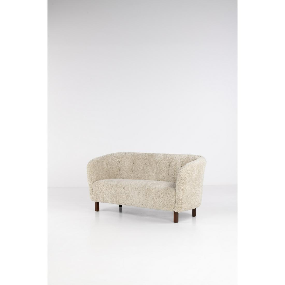 Flemming Lassen (1902-1984), attributed to Sofa: Flemming Lassen (1902-1984), attributed toSofaFabric and mahoganyEdited by Jacob KjaerModel created circa 1940H 80 × L 168 × P 68 cmProvenance: Purchased by engineer Niels Steensen from manu