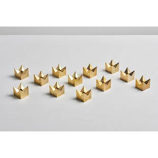 Pierre Forsell (1925-2004) Twelve candlesticks: Pierre Forsell (1925-2004)Twelve candlesticksGilded brassModel 'Kronan' 1607Skultuna editionSigned under the baseH 4 x D 4 x D 4 cm