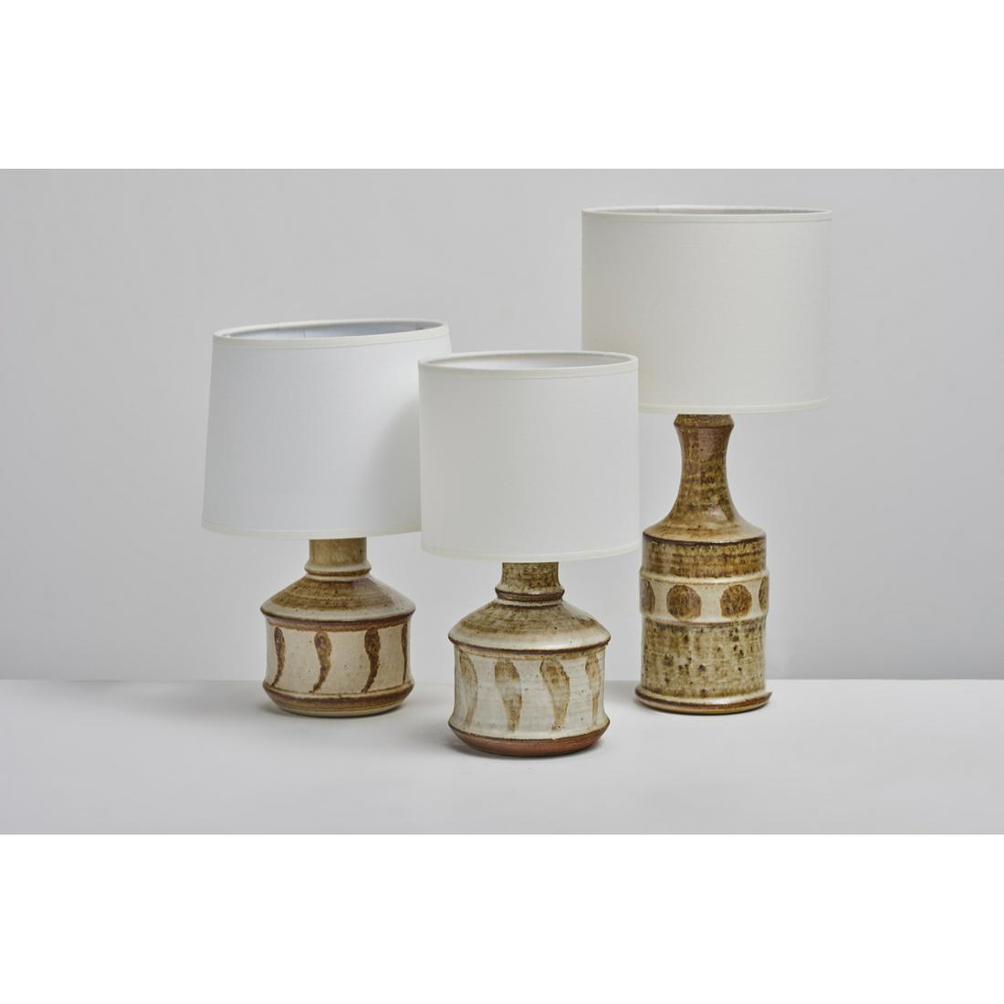 JOSEPH-SIMON (Born in 1934) Set of three lamps: JOSEPH-SIMON (Born in 1934)Set of three lampsGlazed ceramics Editor Soholm StentojSigned under the baseH 16 x D 12 cm (with shade 27 cm) H 15,5 x D 11 cm (with shade 28 cm) H 22 x D 9 cm (with shade 3