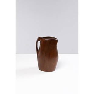 Alexandre Noll (1890-1970) Pitcher: Alexandre Noll (1890-1970)PitcherMahoganyIncised signature 'A Noll' on the undersideModel created c. 1935H 26,5 ×L 18,5 × W 14 cmBibliography: Art & Decoration, april-june 1939, similar mode