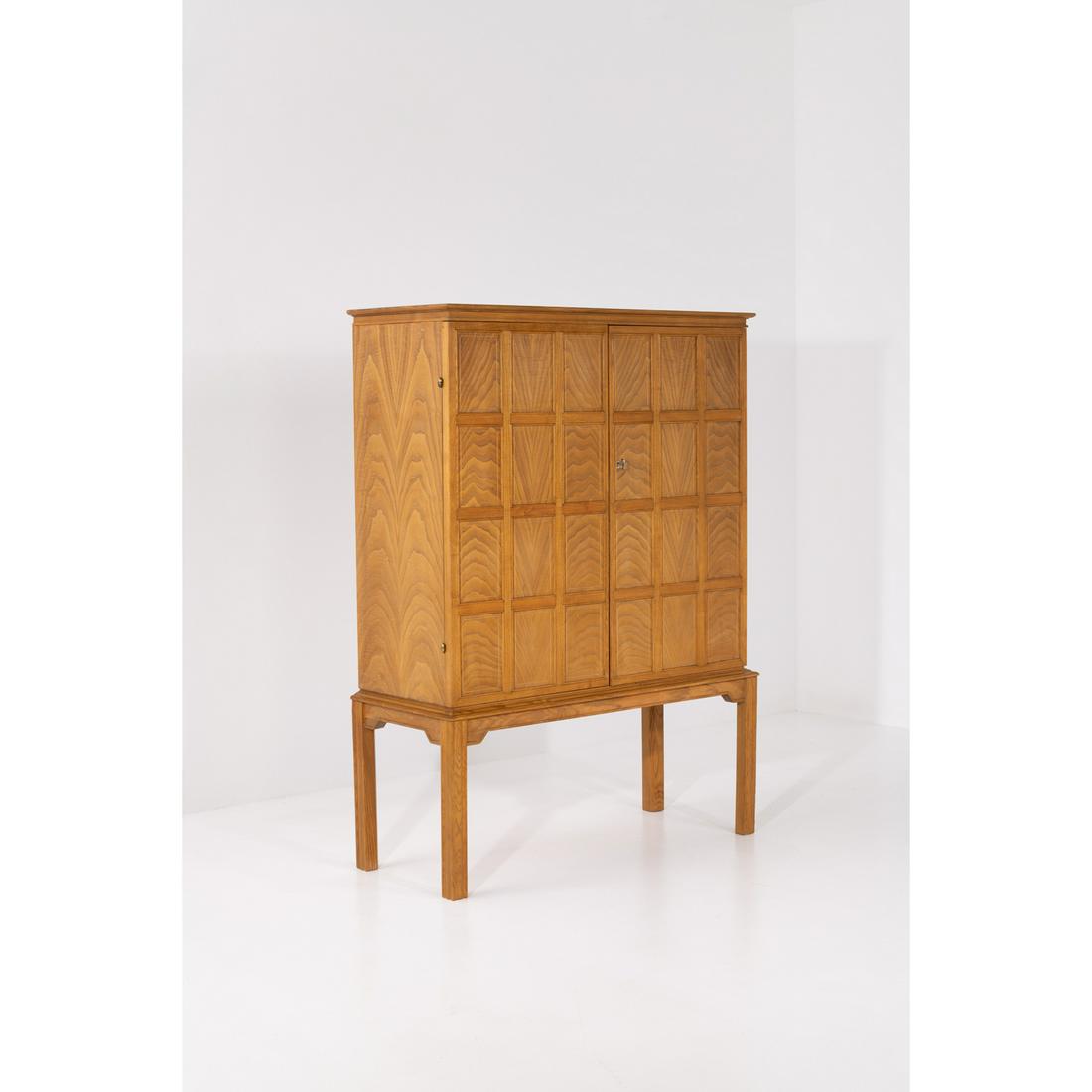 Oscar Nilsson (1895-1975) Cabinet: Oscar Nilsson (1895-1975)CabinetOak woodModel created c. 1940H 150×L 110×W 45cm