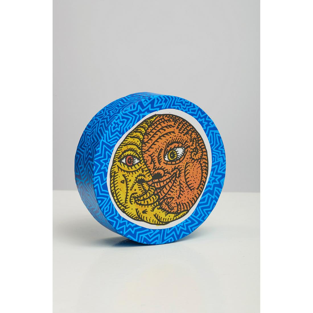 Robert Combas (b. 1957) Le soleil et la lune - 2016: Robert Combas (b. 1957) Le soleil et la lune - 2016 Screen-printed cardboard boxSigned and numbered "77/150" in felt-tip Ø 15 cm This multiple was created by Robert Combas for the Collection Lamb