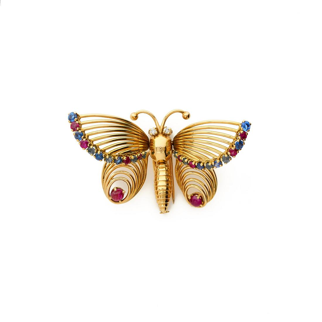 MELLERIO (MELLER) 1960s: MELLERIO (MELLER)1960s'Butterfly' clip in 18k (750‰) yellow gold thread, thearticulated wings adorned with rubies, sapphires,and emeralds, two diamonds as eyesSigned, numbered 1350 BrDimensions: