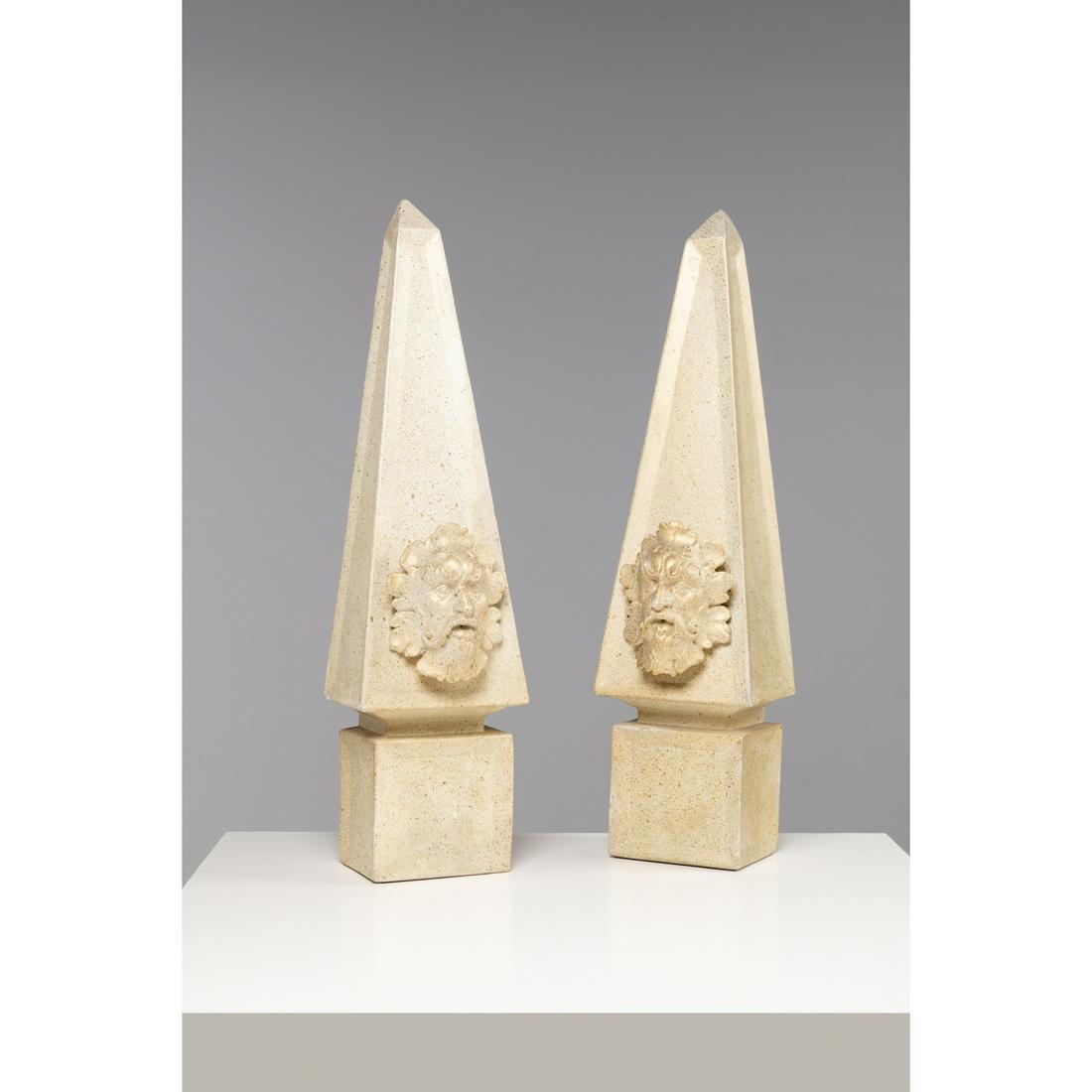 Pair of sconce-mounted obelisks decorated with a faun's head. Patinated plaster: Pair of sconce-mounted obelisks decorated with a faun's head. Patinated plasterH 84 cmRestaurations