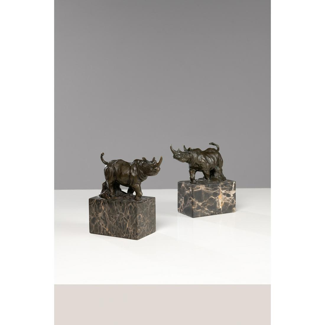 Pair of rhinoceroses in patinated bronze on a veined marble base.  signed Milo and founder's medal (1 of 4)