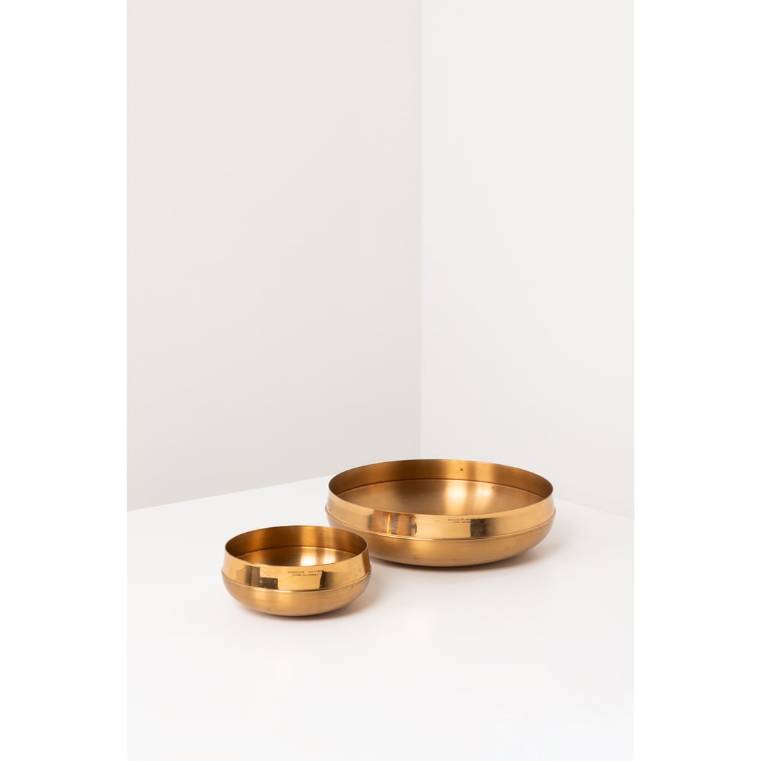 Tapio Wirkkala (1915-1985) Set of two TW 446 and TW 448 cups: Tapio Wirkkala (1915-1985)Set of two TW 446 and TW 448 cupsBronzeEdited by Kultakeskus OyEach stamped with 'KULTAKESKUS OY MADE IN FINLAND DESIGN TAPIO WIRKKALA'Models created circa 1975H 8 x D 29 cmH