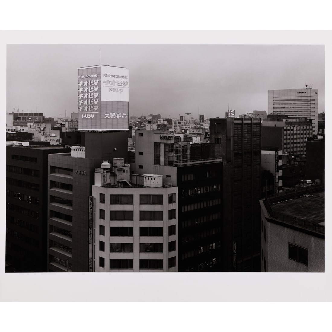 Thomas Struth (born in 1954) Twilight in Marunouchi, Tokyo, 1986-1990: Thomas Struth (born in 1954)Twilight in Marunouchi, Tokyo, 1986-1990Gelatin silver printSigned, dated, titled, situated and numbered on the back: "1/10"Edition of 10 Printed in 199050 x 59,5 cmProvena