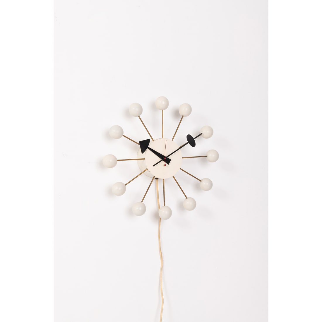 George Nelson (1908-1986) Model 4755, "Ball Clock": George Nelson (1908-1986)Model 4755, "Ball Clock"Painted wood, brass and lacquered metalEdited by Howard Miller Clock CompanyLabel and manufacturer's engraving on the backModel created in 1947Ø 3