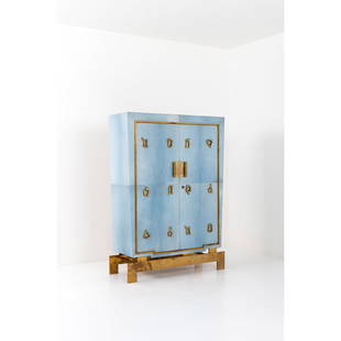 Marc du Plantier (1901-1975) Dresser: Marc du Plantier (1901-1975)DresserParchment-clad wood, brass and gilded bronzeModel created in 1963H 170×L 120×W 46cmBibliography:– Marc du Plantier, Y. Badetz, Ed. Norma, 2010, low