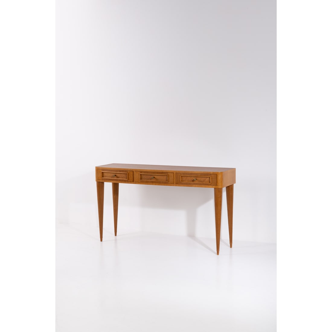 Jean Royère (1902-1981) Console: Jean Royère (1902-1981)ConsoleOak wood, okoumé, caning and brassModel created circa 1950H 91 ×L 160×W 48cmProvenance: Galerie Jacques Lacoste and Galerie Patrick Seguin, ParisBibli