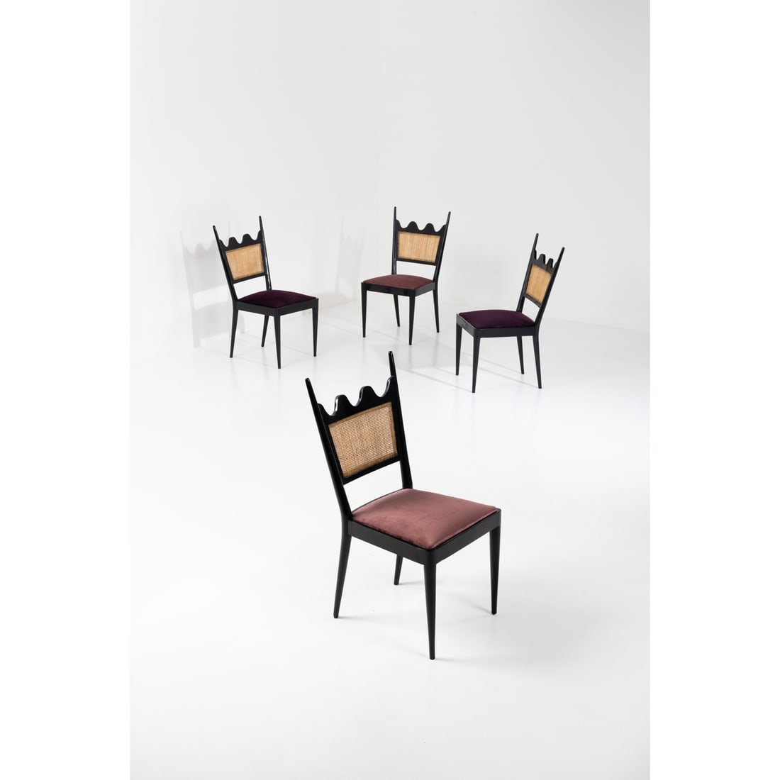 Jean Royère (1902-1981) Set of four 'Ondulation' chairs: Jean Royère (1902-1981)Set of four 'Ondulation' chairs Lacquered wood, caning and fabricModel created circa 1950H 91 ×L 48×W 47cmBibliography: Jean Royère, Galerie Jacques Lacoste