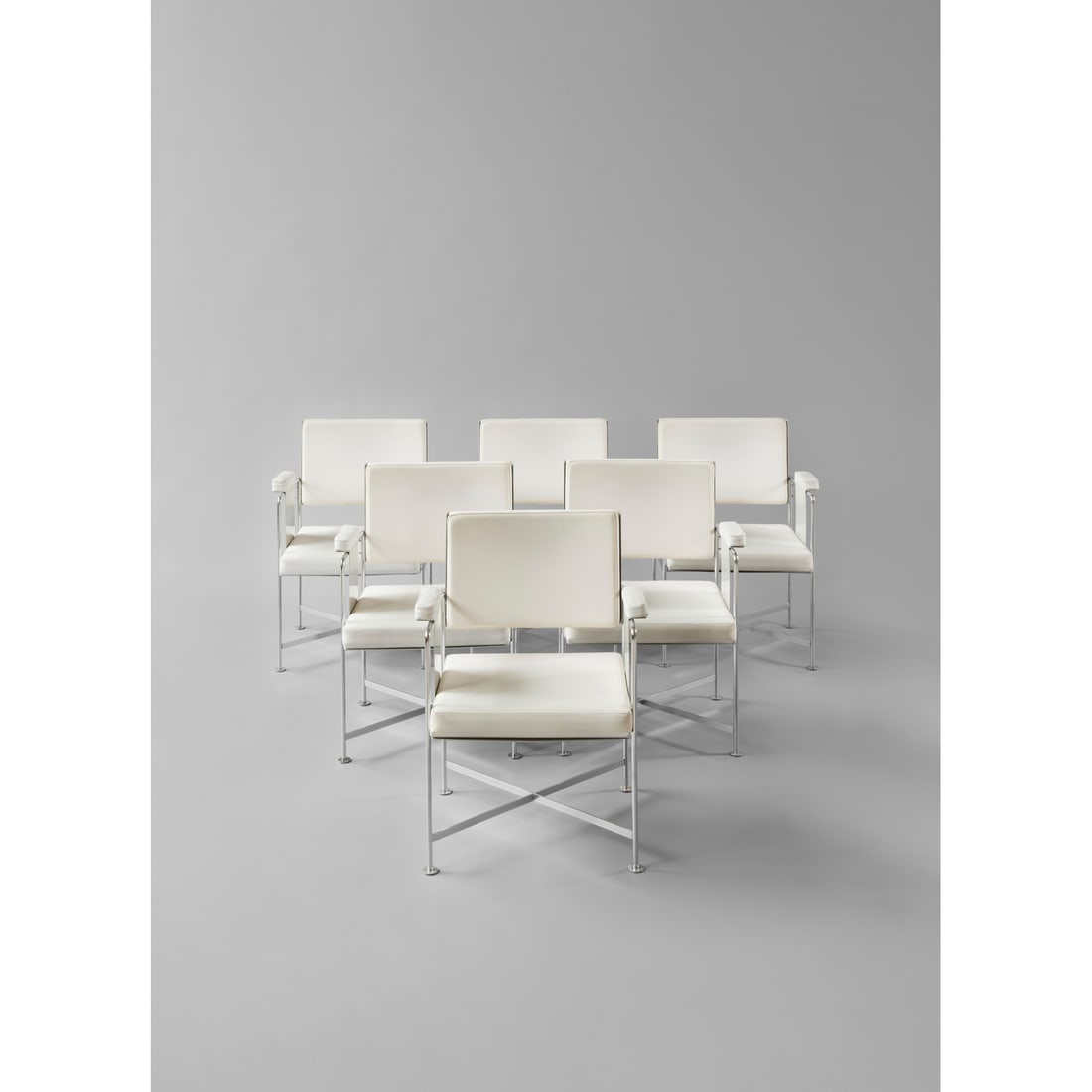 Jacques Dumond (1906-1988) Set of six bridge armchairs, 'France': Jacques Dumond (1906-1988)Set of six bridge armchairs, 'France'Chromed metal, lacquered aluminum and leatheretteEdited by DenneryModel created in 1961 for the Grand salon of the France cruise shipH 87
