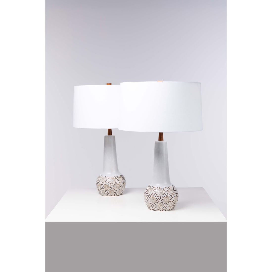 Jane & Gordon Martz (20th c.) Pair of table lamps: Jane & Gordon Martz (20th c.)Pair of table lampsWalnut, ceramic, brass and fabricEdited by Marshall StudiosSigned "Martz" on the baseModel created in the 1960sH 70 × Ø 46 cm