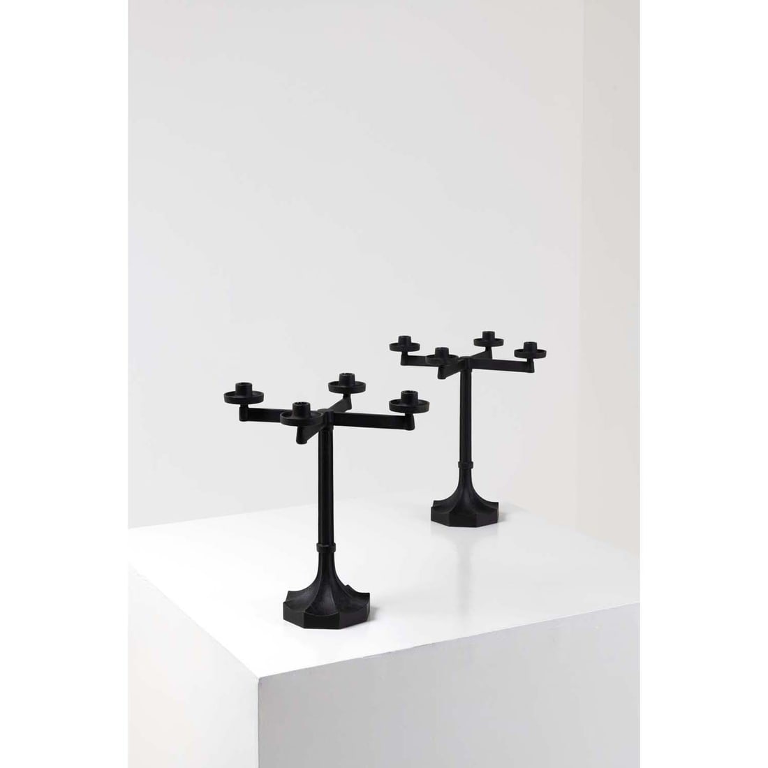 Sigurd Persson (1914-2003) Pair of chandeliers with four arms Cast metal Edited by Kockums Debossed: Sigurd Persson (1914-2003)Pair of chandeliers with four armsCast metalEdited by KockumsDebossed inscription, 'SIG P KOCKUMS' and dated '1966' beneath the baseModel created circa 1960H 40 × L 35 &