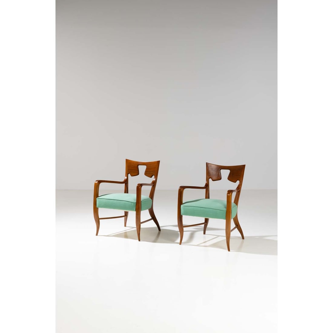 Gio Ponti (1891-1979) Pair of armchairs: Gio Ponti (1891-1979) Pair of armchairs Walnut and velvet Edited by Giordano Chiesa Model created in 1946 H 82 × L 57 × W 62 cm Bibliography: R. Aloi, L’Arradamento Moderno,Milan, 1949, ill. 577 E