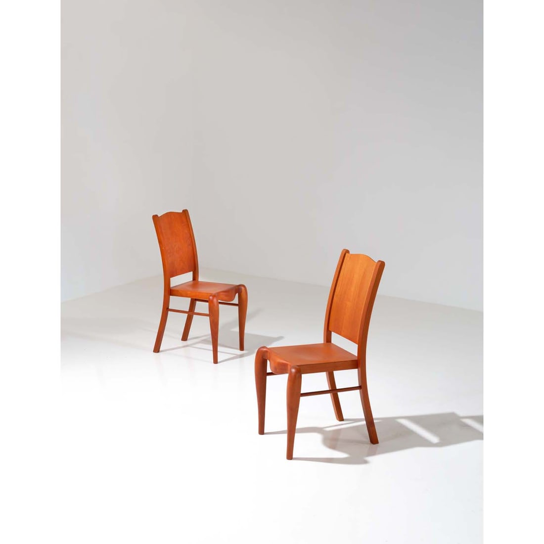 Philippe Starck (born 1949) Pair of chairs, model 'Placide of the wood': Philippe Starck (born 1949)Pair of chairs, model 'Placide of the wood'Cherrywood and birchEdited by DriadeModel created circa 1989H 92,5 × L 43 × W 47 cm