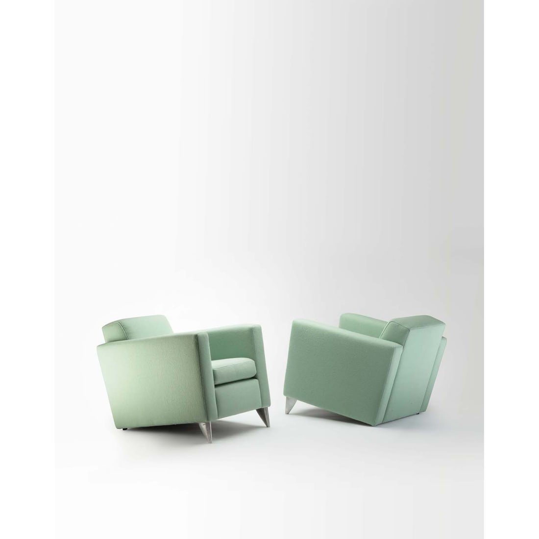 Philippe Starck (born 1949) Pair of armchairs, model 'Len Niggelman': Philippe Starck (born 1949)Pair of armchairs, model 'Len Niggelman'Fabric and cast aluminumEdited by 3 SuissesStamped with 'Starck' on the feetModel created in 1985H 70 × L 70 × W 85 cm