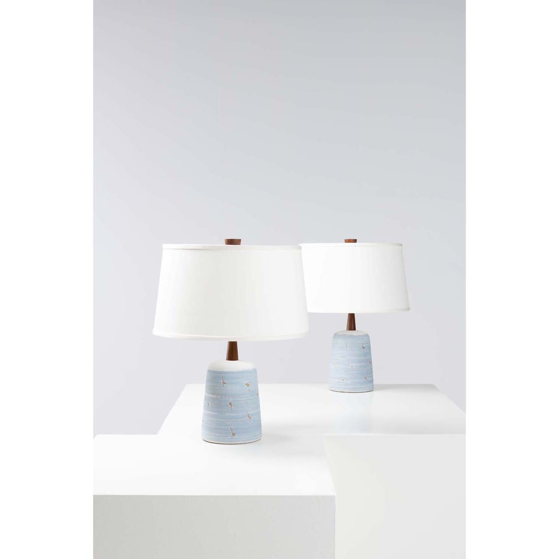 Jane & Gordon Martz (20th c.) Pair of table lamps: Jane & Gordon Martz (20th c.)Pair of table lampsCeramic, walnut, brass and fabricEdited by Marshall StudiosSigned 'Martz' on the basesModel created in the 1960sH 52,5 × Ø 40 cm