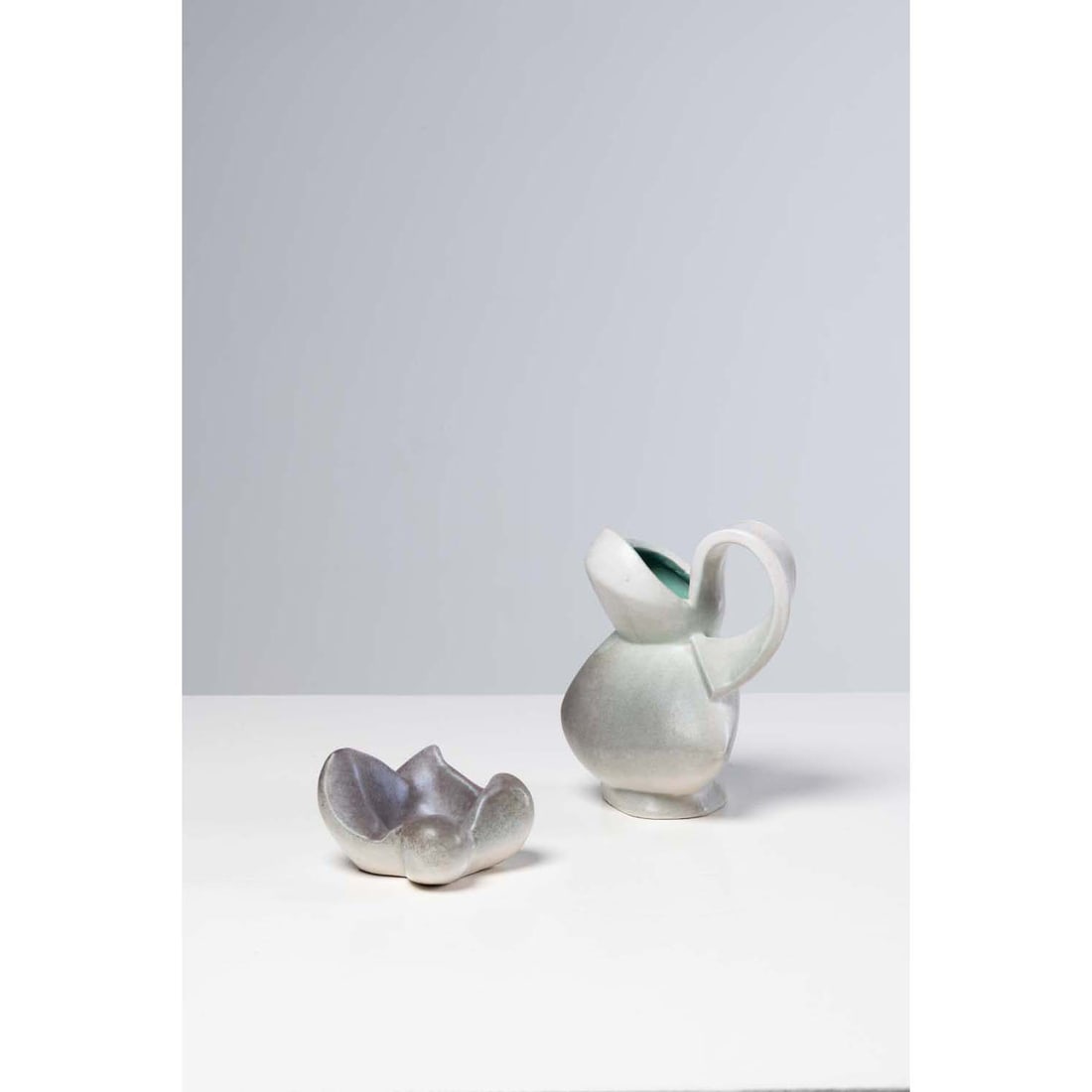 Jacques Blin (1920-1995) Pitchers Glazed earthenware Signed 'Blin' under the cover on the reverse: Jacques Blin (1920-1995) PitchersGlazed earthenwareSigned 'Blin' under the cover on the reverseModel created circa 1960H 19.5 x W 16 x D 18 cm Joined: a bowl attributed to Jacques Blin H 8 x W 14 x D