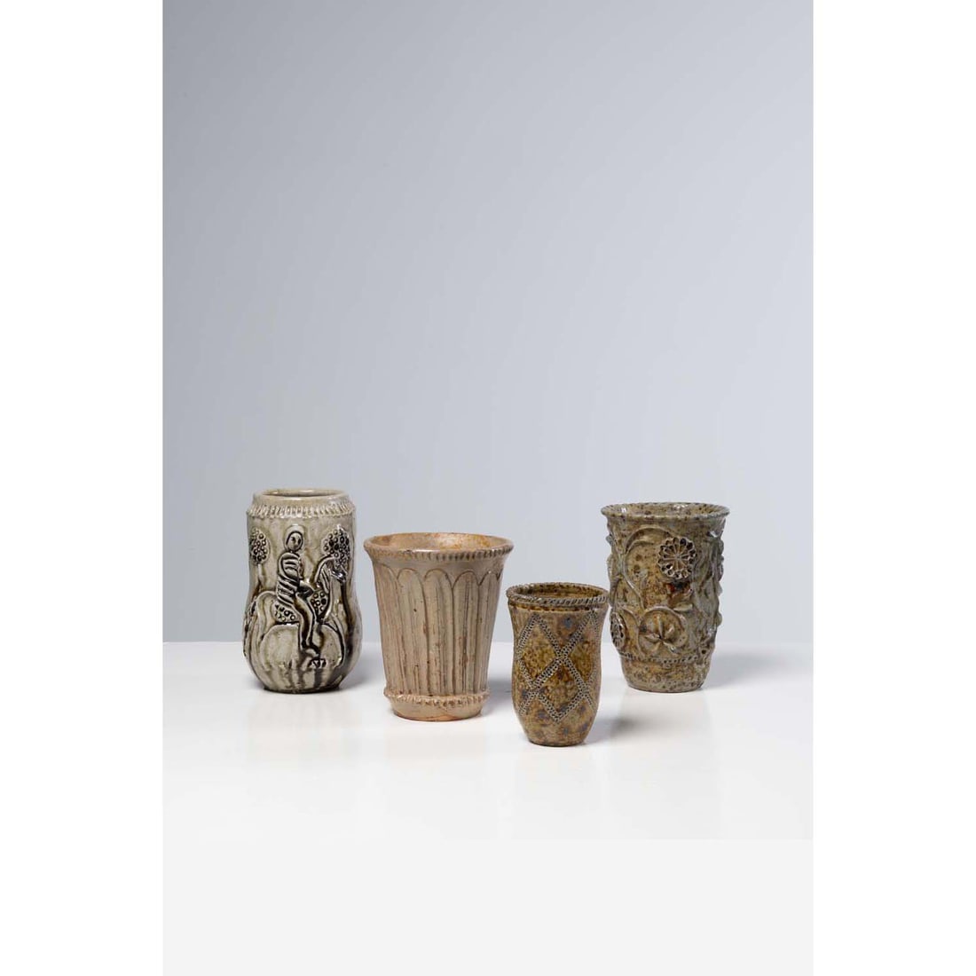 Jean (1913-1992) and Jacqueline Lerat (1920-2009) Suite of four vases Glazed stoneware Signed on the: Jean (1913-1992) and Jacqueline Lerat (1920-2009)Suite of four vasesGlazed stonewareSigned on the reverse 'J Lerat', located 'La Borne' and dated between 1947 and 1983H 21.5 x D 15 cmH 19 x D 16.5 cmH