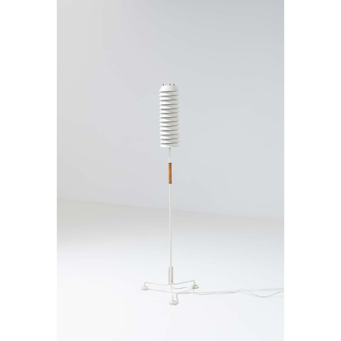 Ilmari Tapiovaara (1914-1999) Floor lamp, 'Maija the Bee': Ilmari Tapiovaara (1914-1999)Floor lamp, 'Maija the Bee'Lacquered metal, brass and rattanEdited by Hienoteräs OyStamped with 'Hienoteräs'Model created circa 1950H 140 × Ø 39 cmBibl