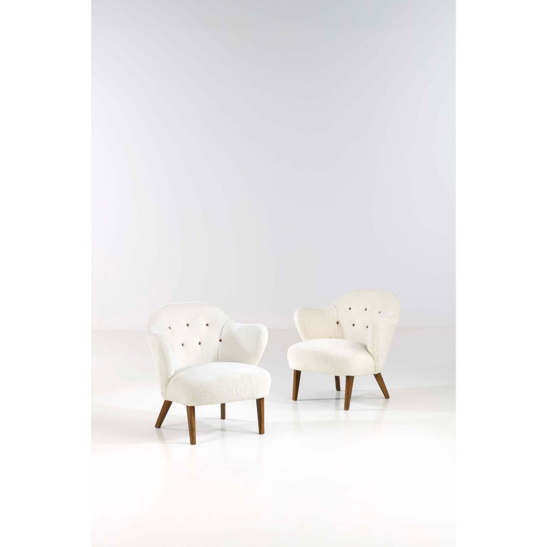 Flemming Lassen (1902-1984) Pair of armchairs: Flemming Lassen (1902-1984)Pair of armchairsTeak and fabricEdited by Jacob KjaerModel created circa 1940H 77 × L 75 × W 61 cm