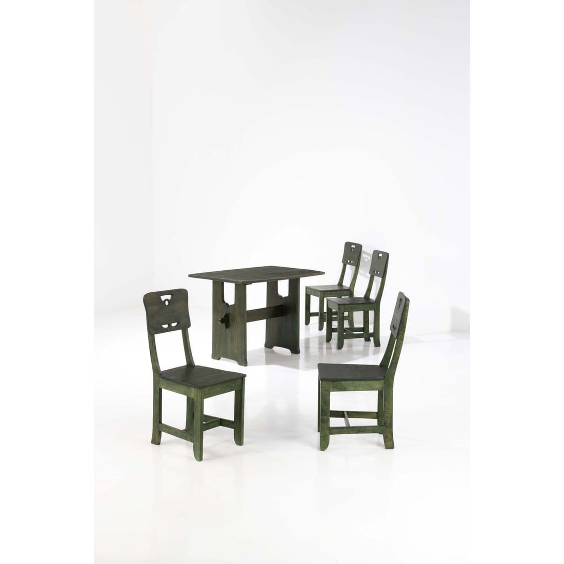 Carl Westman (1866-1936) Set of four chairs and a table: Carl Westman (1866-1936)Set of four chairs and a tableTinted woodModel created circa 1920Chairs: H 93 × L 40 × W 47 cmTable: H 78 × L 109 × W 72,5 cm