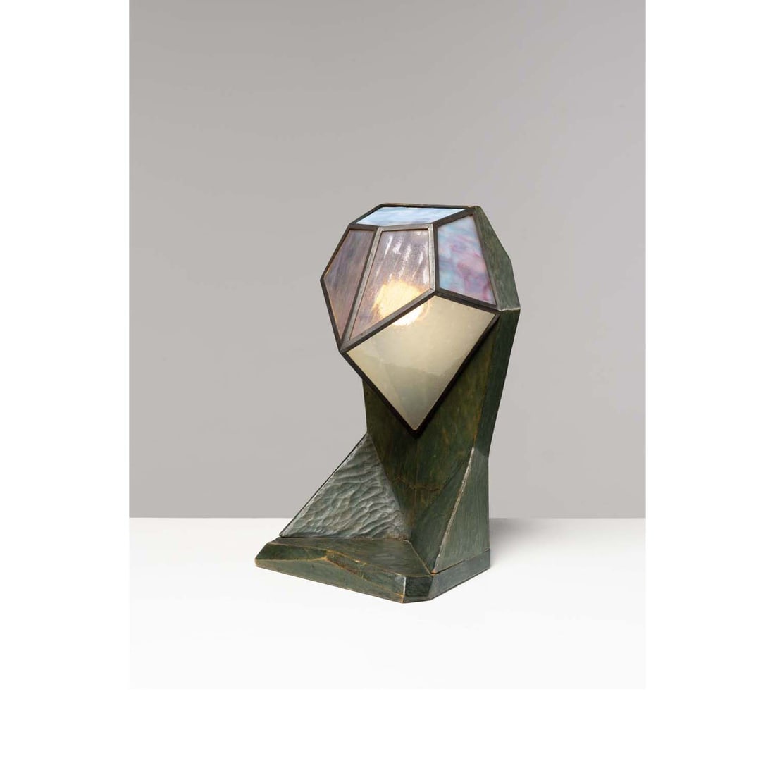 Wilhelm von Heydebrand (1888-1970) Lamp: Wilhelm von Heydebrand (1888-1970)LampTinted wood (original varnish) and iridescent glass Model created circa 1920H 42 × L 21 × W 17 cmBibliography: Dornach Design: Möbelkunst 1911 bis