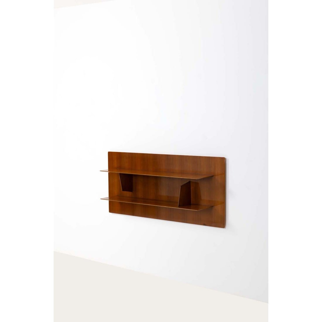 Gio Ponti (1891-1979) Wall shelf: Gio Ponti (1891-1979)Wall shelfWalnutEdited by Giordano Chiesa (stamps on the back)Model created in 1960H 65 × L 140 × W 31 cmExpertise conducted by the Gio Ponti Archives