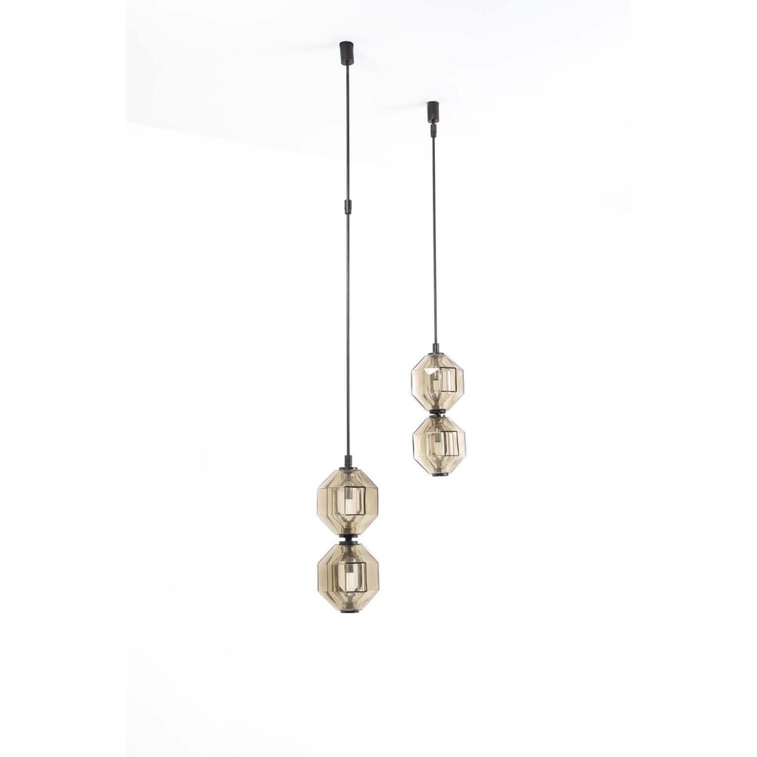 Vinicio Vianello (1923-1999) Set of two suspensions: Vinicio Vianello (1923-1999)Set of two suspensionsBrass, bronze and glassModel created circa 1957H 140 × Ø 21 cmH 185 × Ø 21 cm